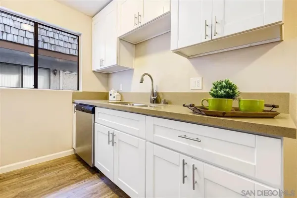 a kitchen with a sink and cabinets