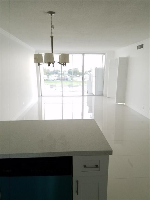3150 North Course Lane, Unit 607 Pompano Beach, FL 33069 - Photo 2 of 16 a view of a room with a window