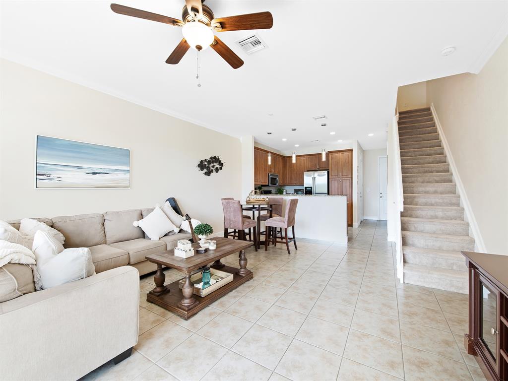 4792 Sundance Way, Unit 4792 Davie, FL 33328 - Photo 18 of 33 a living room with furniture and kitchen view