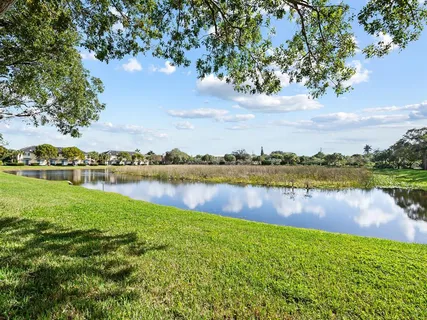 a view of a lake with houses in the back