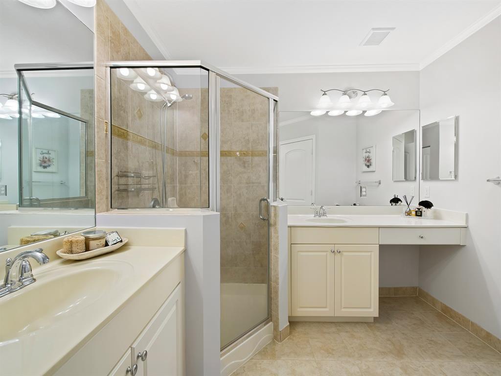 4792 Sundance Way, Unit 4792 Davie, FL 33328 - Photo 24 of 33 a bathroom with a double vanity sink mirror and shower