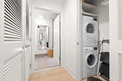 a view of a hallway with washer and dryer