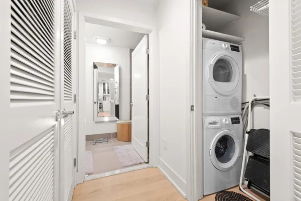 a view of a hallway with washer and dryer