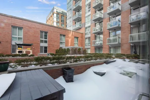 a view of swimming pool with outdoor seating