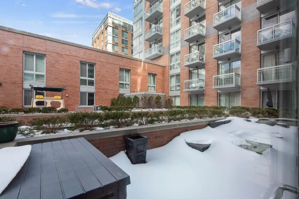 a view of swimming pool with outdoor seating