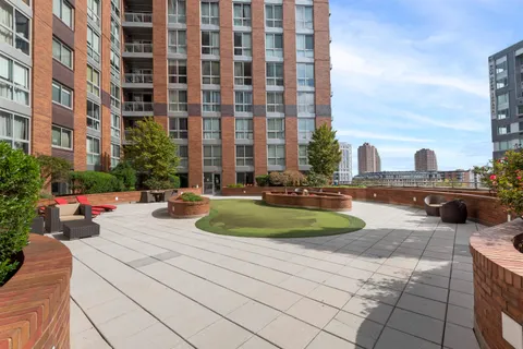 a front view of a building with outdoor seating