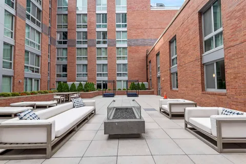 a view of a building with outdoor seating