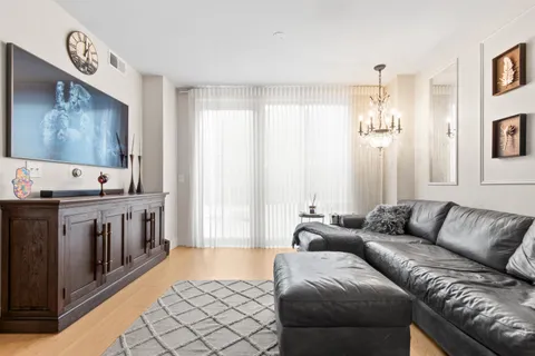 a living room with furniture and large window