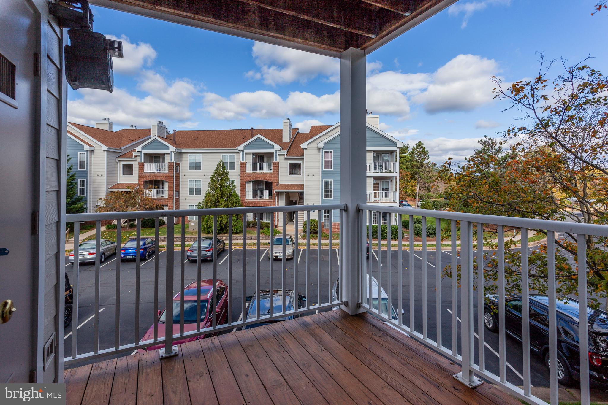 21012 Timber Ridge Terrace, Unit 201 Ashburn, VA 20147 - Photo 28 of 37 a view of a house with wooden fence