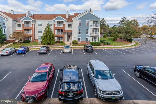 a front view of a house with a garden and patio