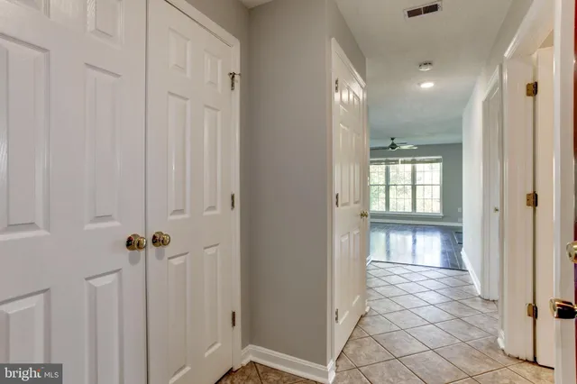a view of a hallway with windows
