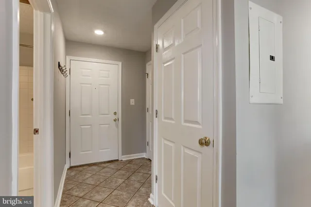 a view of a hallway with closet area