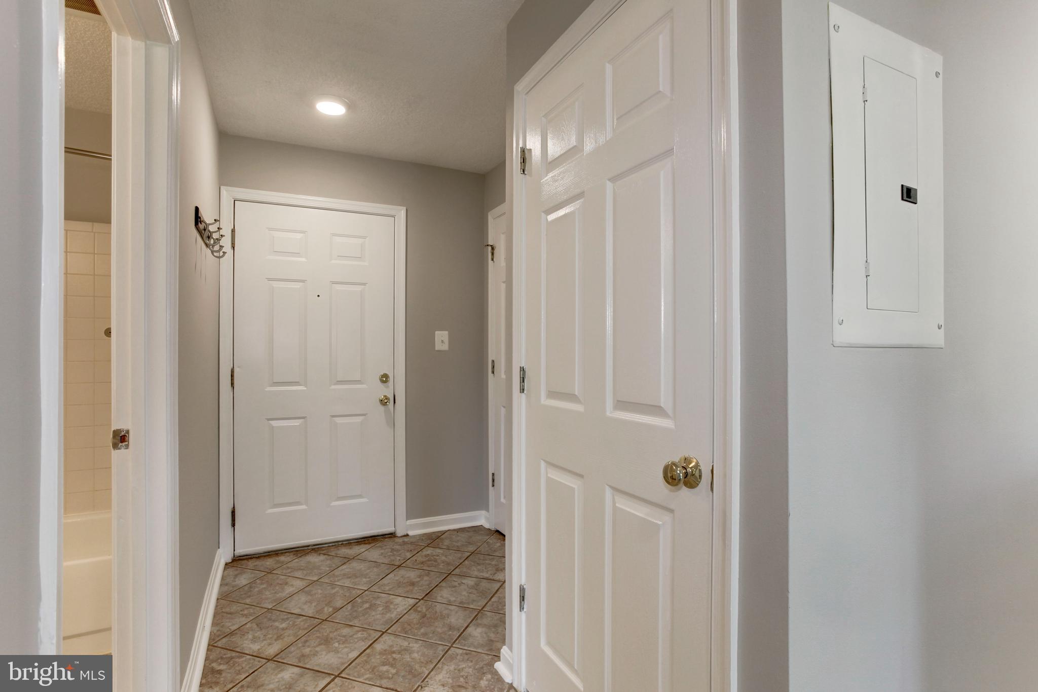 21012 Timber Ridge Terrace, Unit 201 Ashburn, VA 20147 - Photo 6 of 37 a view of a hallway with closet area