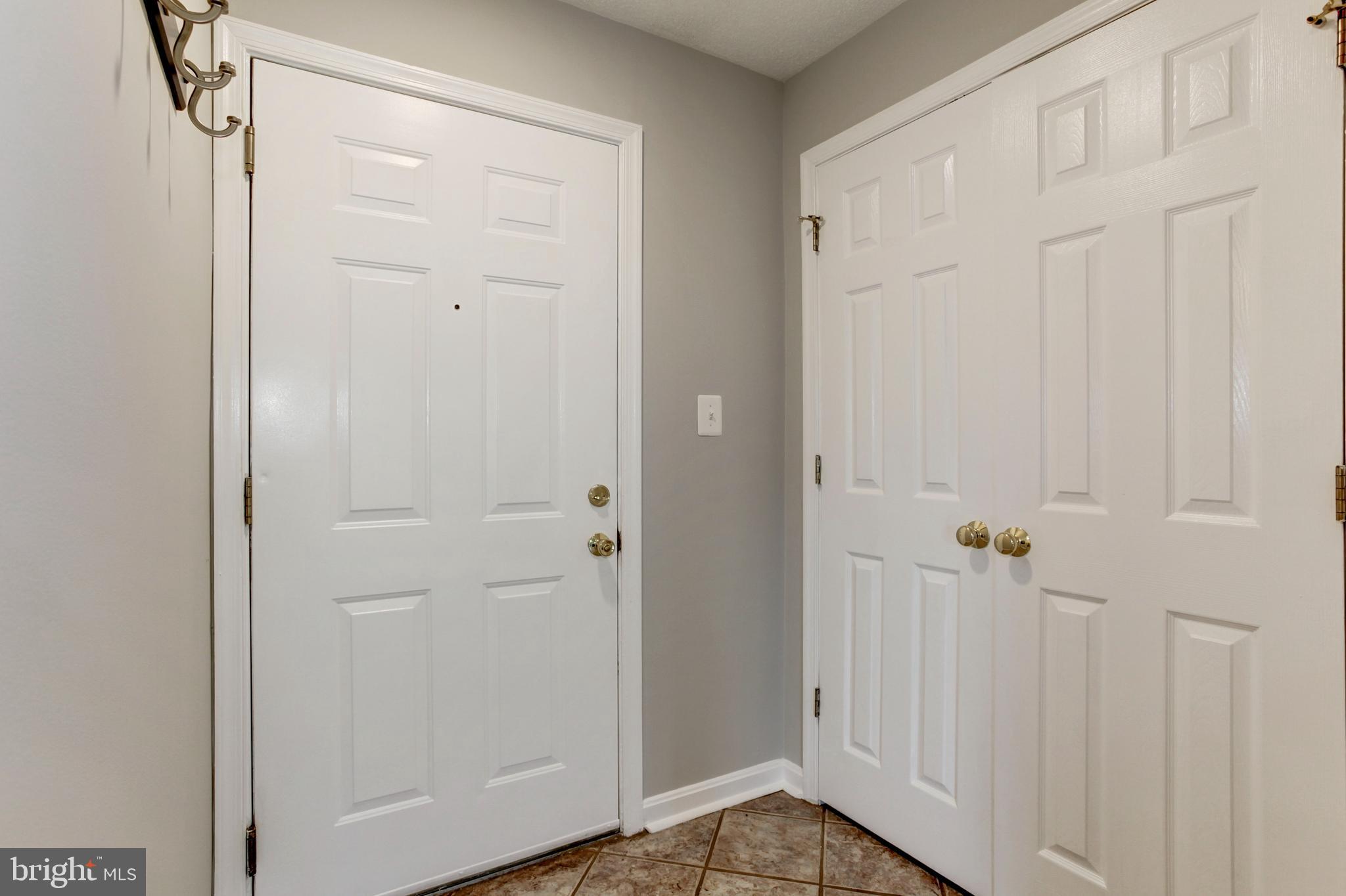 21012 Timber Ridge Terrace, Unit 201 Ashburn, VA 20147 - Photo 7 of 37 a view of front door