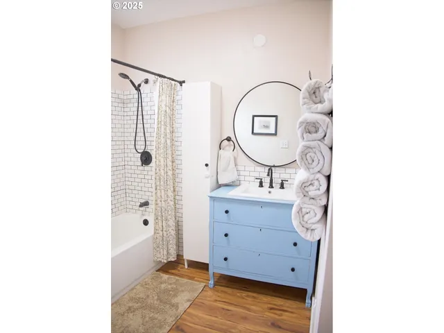 a view of bathroom with mirror