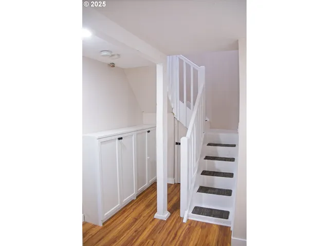 a view of a living room with a wooden floor