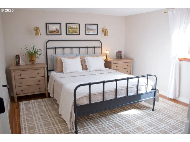 a bedroom with a bed and a table in it