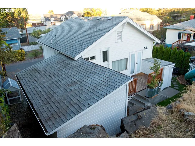 a view of a house with wooden deck