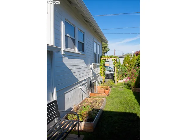 a balcony with chairs and a table