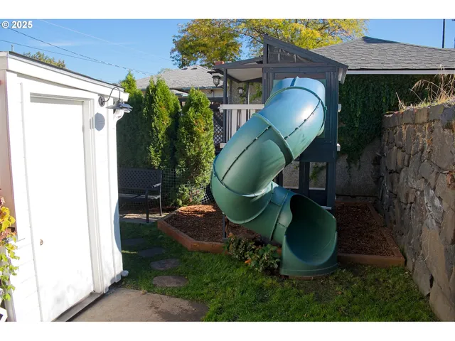 a swimming pool with outdoor seating and yard