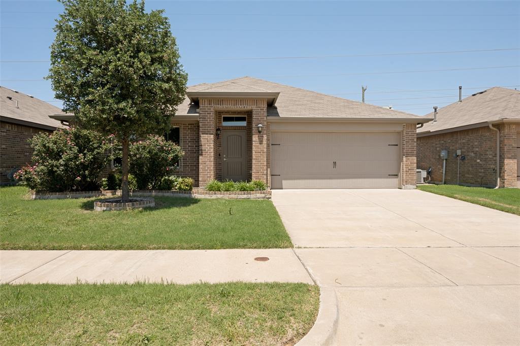 857 Watson Way Crowley, TX 76036 - Photo 1 of 25 Brick-front residence featuring an attached two-car garage with a concrete driveway