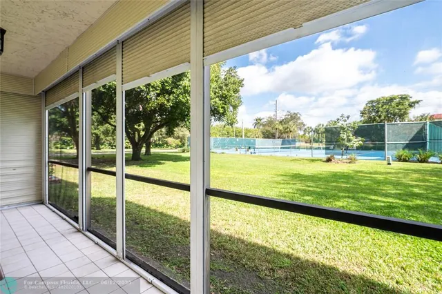 a utility room with cabinets washer and dryer