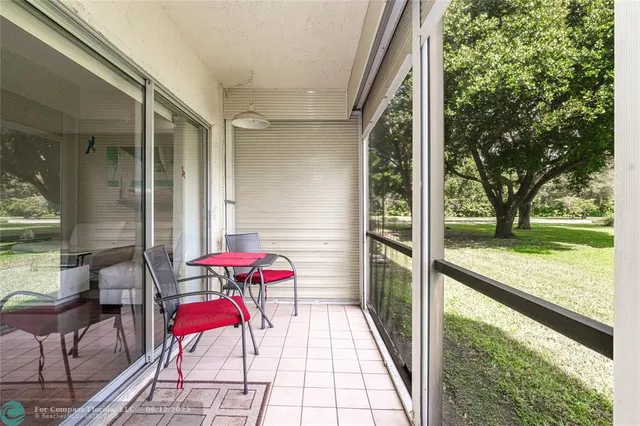 a view of a hallway with a wooden floor