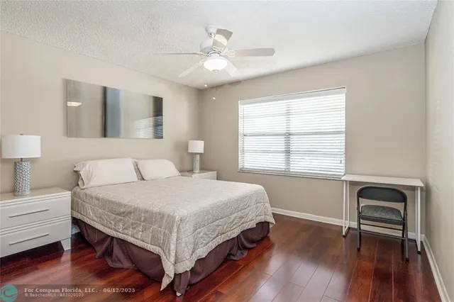 a view of walk in closet with clothes