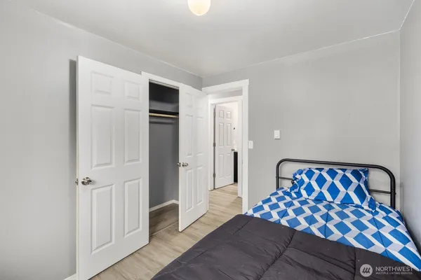 a bedroom with a bed and window