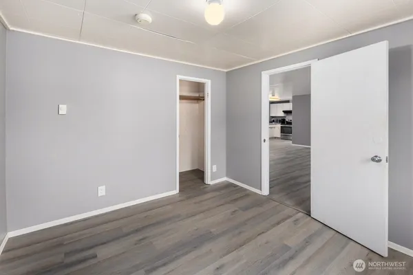 an empty room with wooden floor