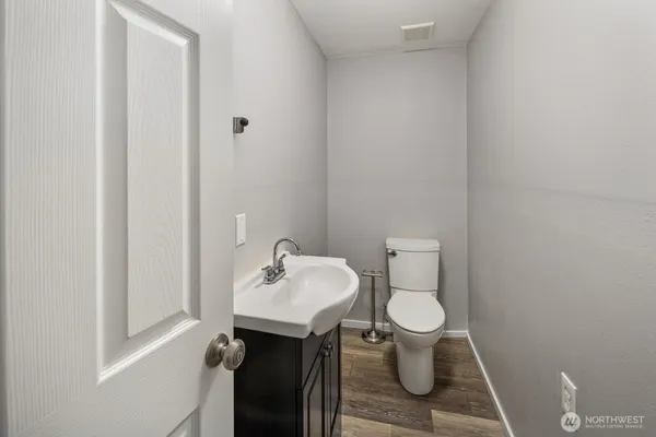 a bathroom with a toilet and a sink