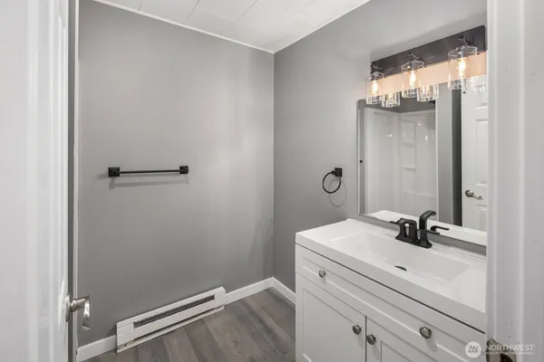 a bathroom with a sink and a mirror