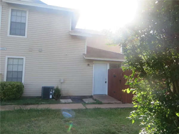 a view of backyard of a house