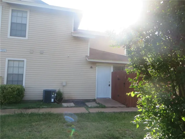 a view of backyard of a house
