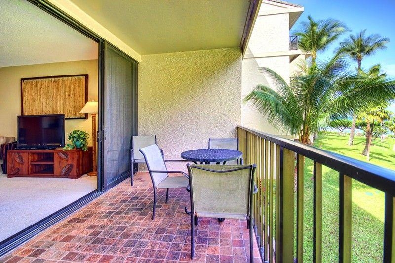 3445 Lower Honoapiilani Road, Unit 255 Lahaina, HI 96761 - Photo 11 of 35 a balcony with table and chairs