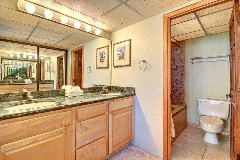 3445 Lower Honoapiilani Road, Unit 255 Lahaina, HI 96761 - Photo 12 of 35 a bathroom with a granite countertop sink toilet and shower