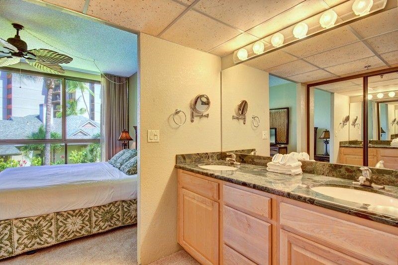 3445 Lower Honoapiilani Road, Unit 255 Lahaina, HI 96761 - Photo 13 of 35 a bathroom with a granite countertop sink and a large mirror