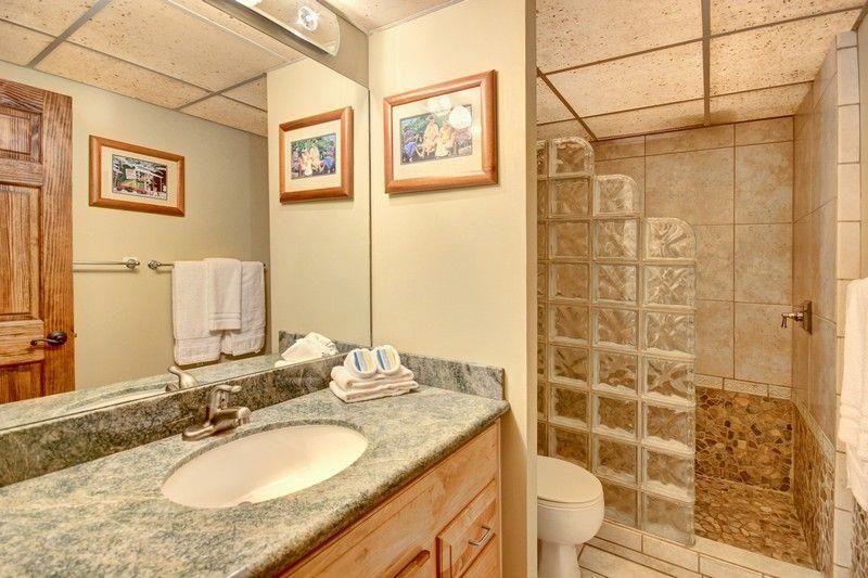 3445 Lower Honoapiilani Road, Unit 255 Lahaina, HI 96761 - Photo 19 of 35 a bathroom with a granite countertop shower sink and mirror