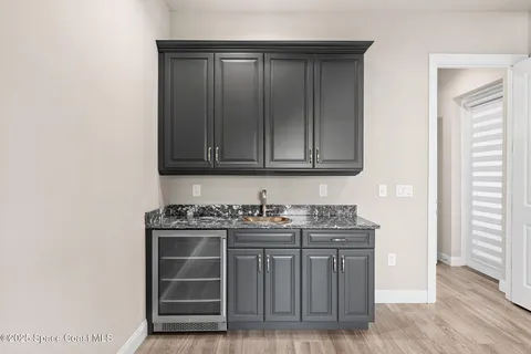 a kitchen with stainless steel appliances wooden cabinets and a stove