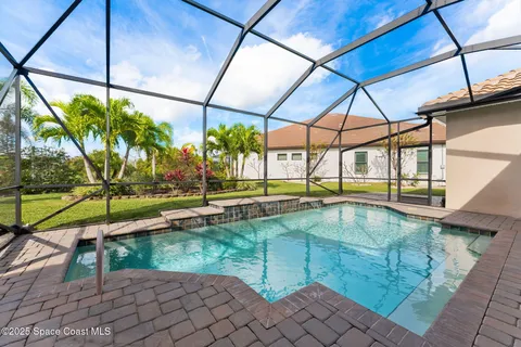 a view of swimming pool with a yard