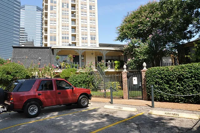 a front view of a house with parking