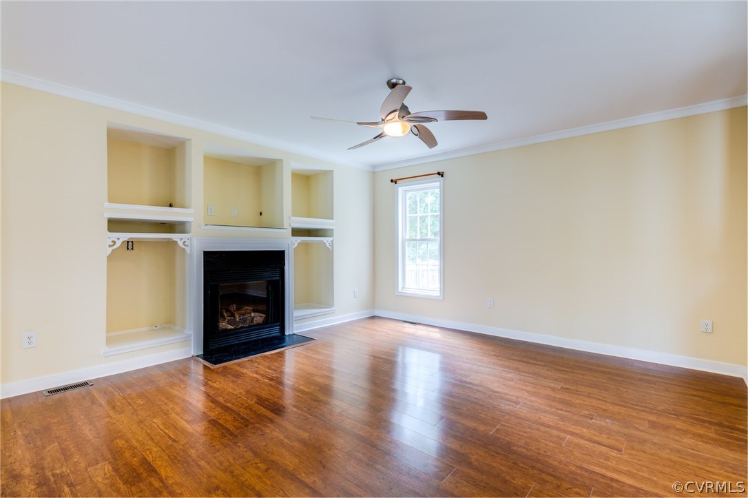 9601 Dunroming Road Chesterfield, VA 23832 - Photo 11 of 34 a view of empty room with wooden floor and fireplace