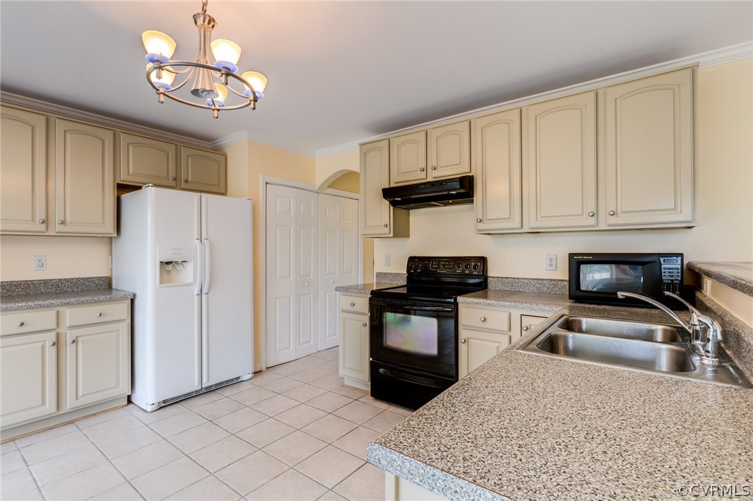 9601 Dunroming Road Chesterfield, VA 23832 - Photo 19 of 34 a kitchen with white cabinets and stainless steel appliances