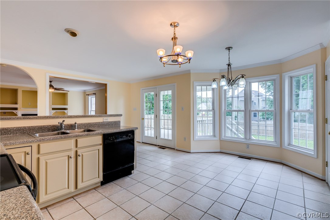 9601 Dunroming Road Chesterfield, VA 23832 - Photo 20 of 34 a large kitchen with kitchen island granite countertop a stove a sink and a granite counter tops