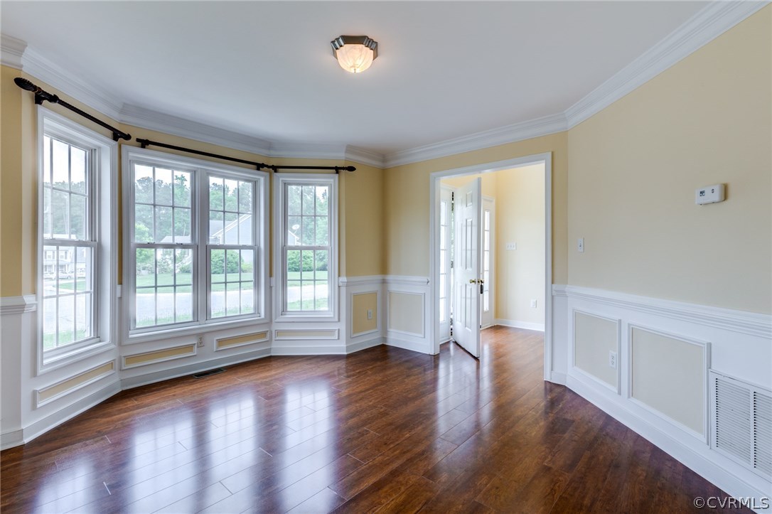 9601 Dunroming Road Chesterfield, VA 23832 - Photo 21 of 34 an empty room with wooden floor and windows with curtains view