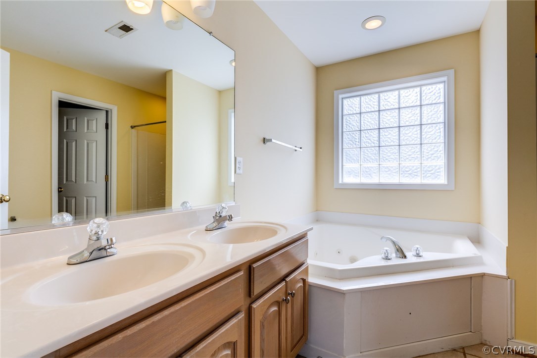 9601 Dunroming Road Chesterfield, VA 23832 - Photo 24 of 34 a bathroom with a sink and a bathtub