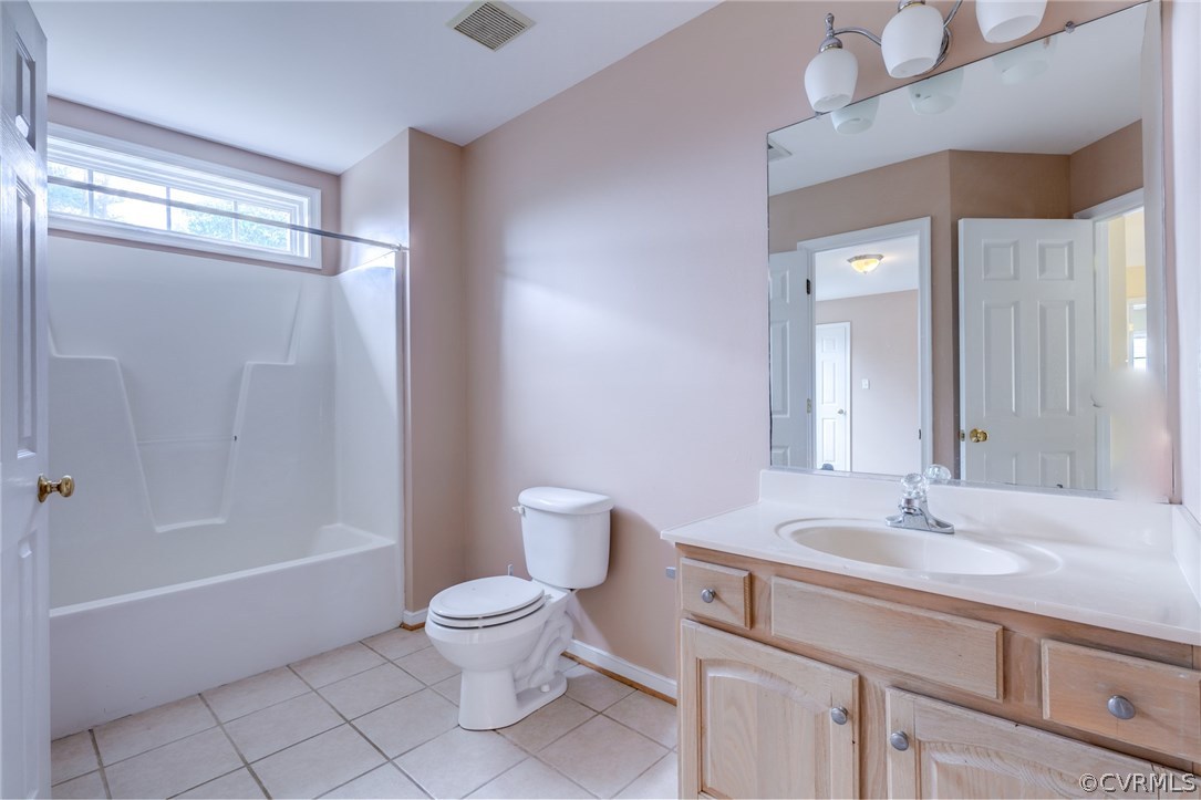 9601 Dunroming Road Chesterfield, VA 23832 - Photo 30 of 34 a bathroom with a sink a toilet and shower