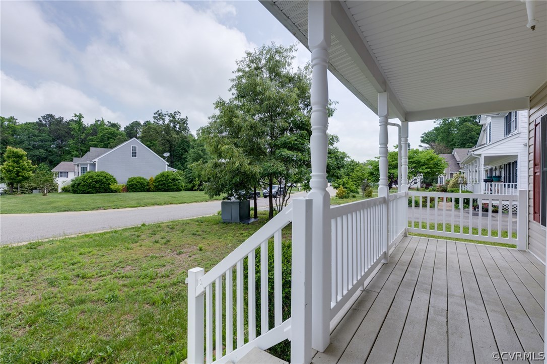 9601 Dunroming Road Chesterfield, VA 23832 - Photo 4 of 34 a view of a deck with wooden floor and fence next to a yard