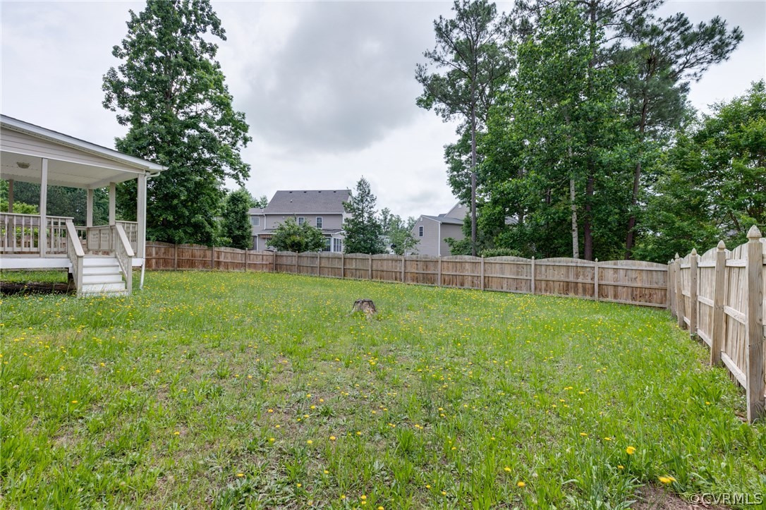 9601 Dunroming Road Chesterfield, VA 23832 - Photo 6 of 34 a view of a house with a backyard