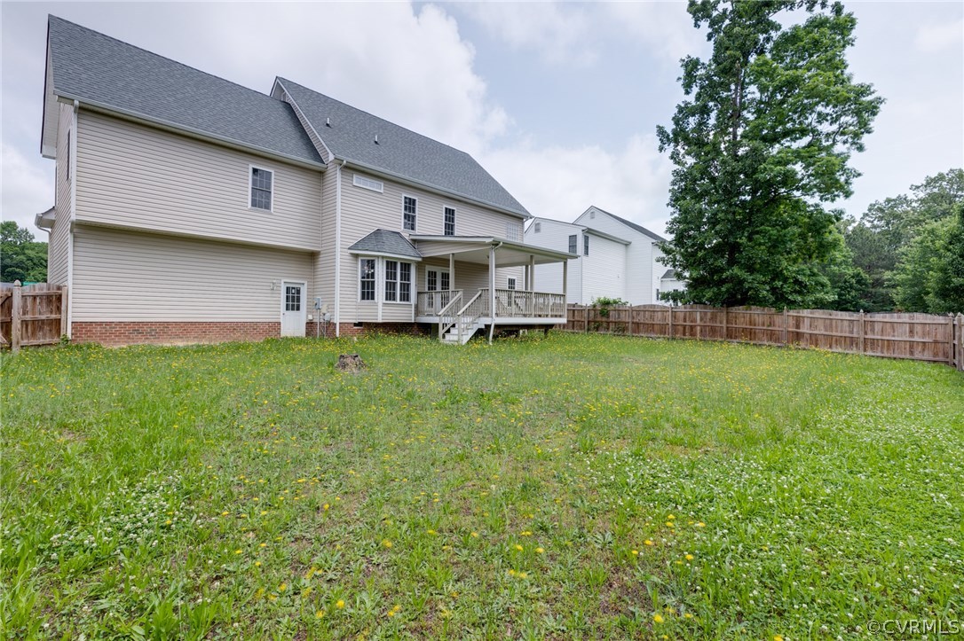 9601 Dunroming Road Chesterfield, VA 23832 - Photo 7 of 34 a view of a house with a yard and sitting area